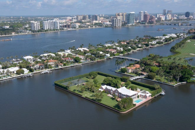 Seen in the foreground, private Tarpon Island in Palm Beach is on the market for $210 million, which includes a major renovation-and-expansion project to the house, or for $125 million as is.