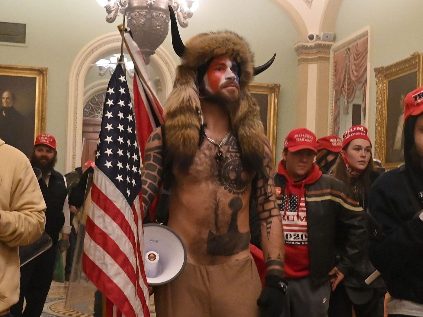 A well-known QAnon influencer dubbed the 'Q Shaman' played a highly visible  role in the Capitol siege