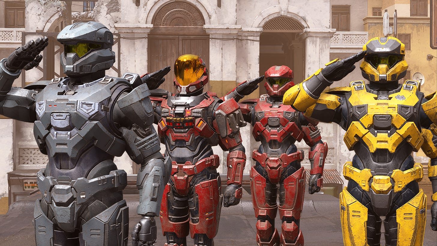 Four spartan characters from the Halo games, two in red, one in grey, and one in yellow, all saluting.
