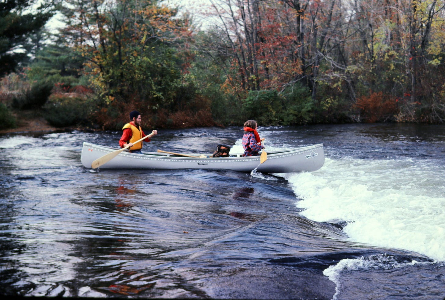 Canoe going over rapids, Eel's Creek, 1982