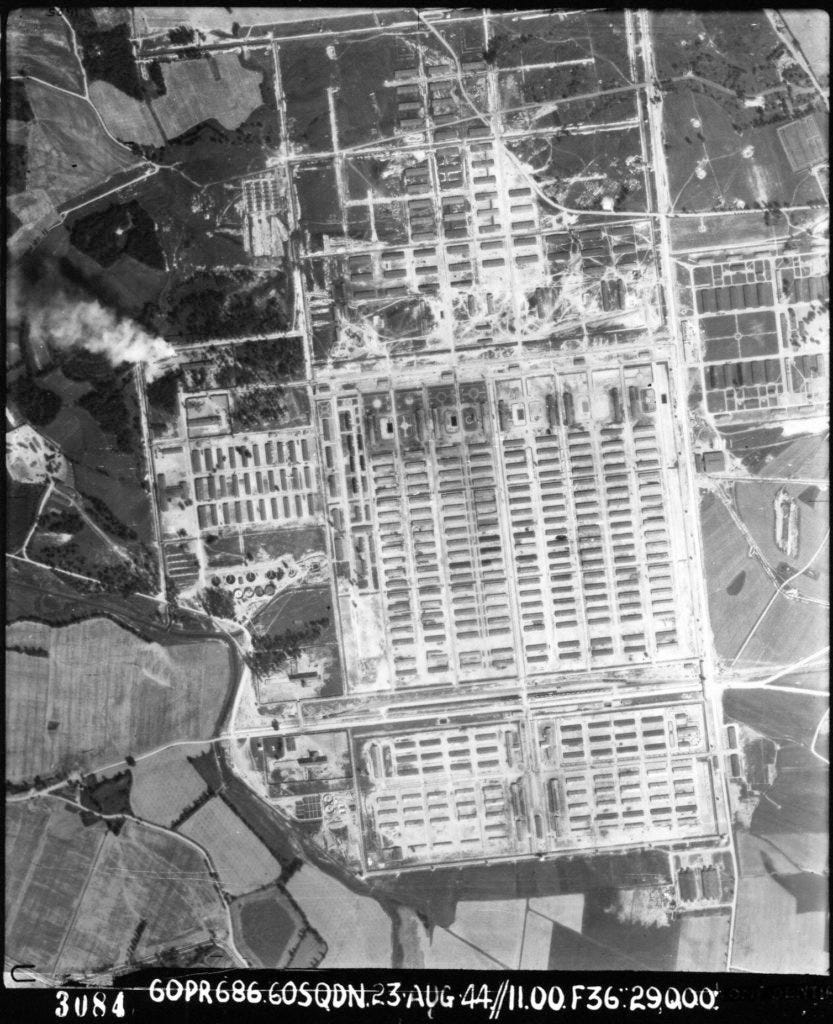 Aerial view of Auschwitz-Birkenau II. A massive complex of huts laid out in a grid format