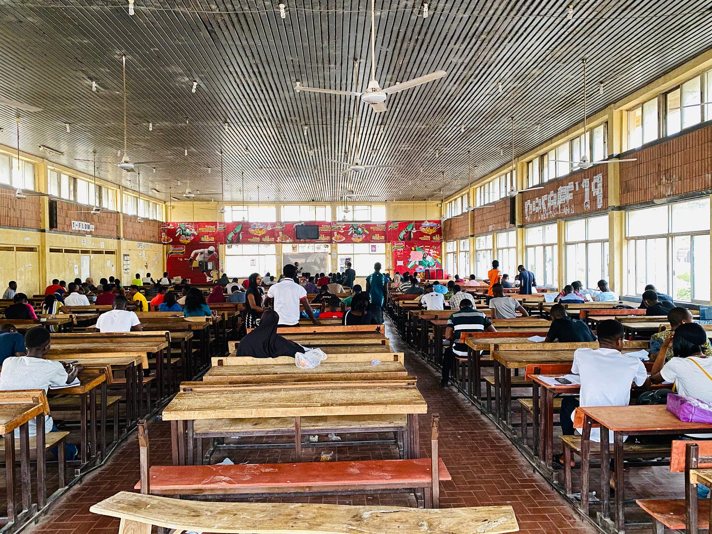 Undergraduate students studying in an old lecture hall in Federal University of Technology Minna, Nigeria