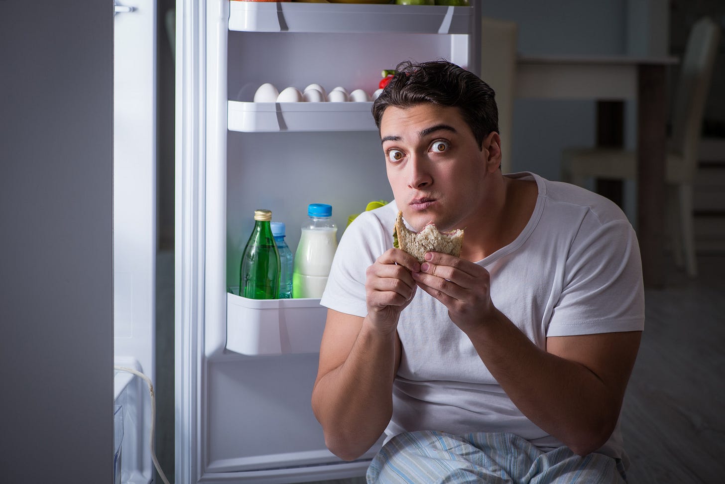 Man Eating at Night