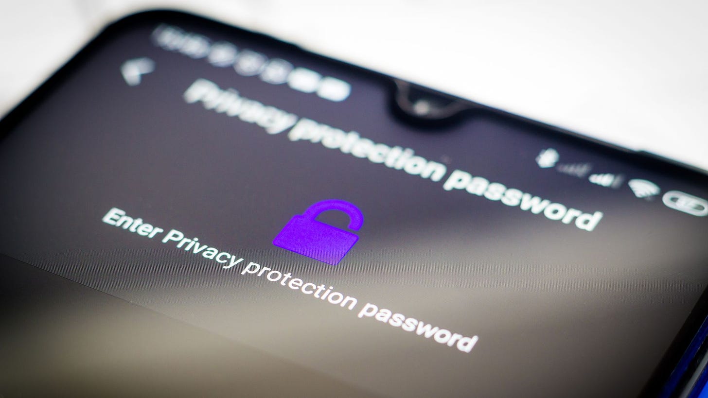 A photo of a smartphone depicting a password screen for a privacy protection feature