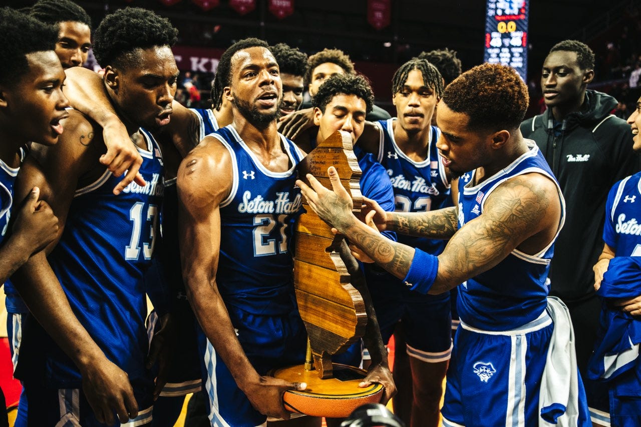 KC Ndefo (13) celebrates with his Seton Hall teammates after beating Rutgers on Dec. 11, 2022. (Photo by Lokesh Sutherland / courtesy of Seton Hall athletics)