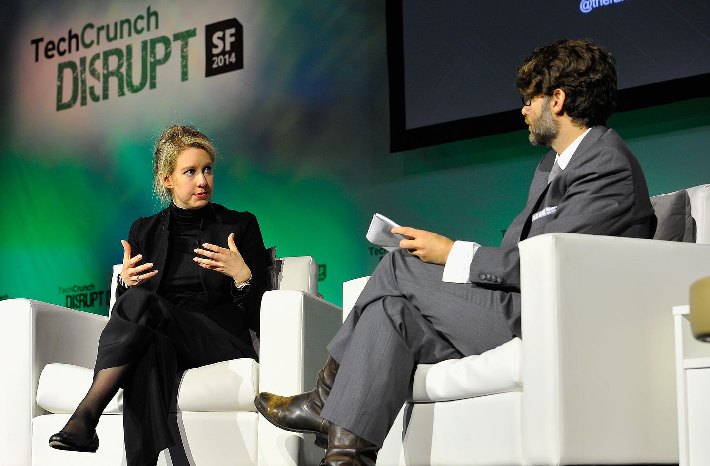 File:Theranos Chairman, CEO and Founder Elizabeth Holmes (L) and TechCrunch  Writer and Moderator Jonathan Shieber speak onstage at TechCrunch Disrupt  at Pier 48 on September 8, 2014 (14995888227).jpg - Wikimedia Commons
