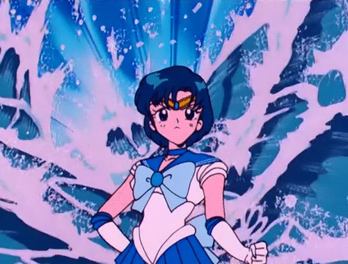 Sailor Mercury stands in front of her water attack (Sailor Moon, 1992)