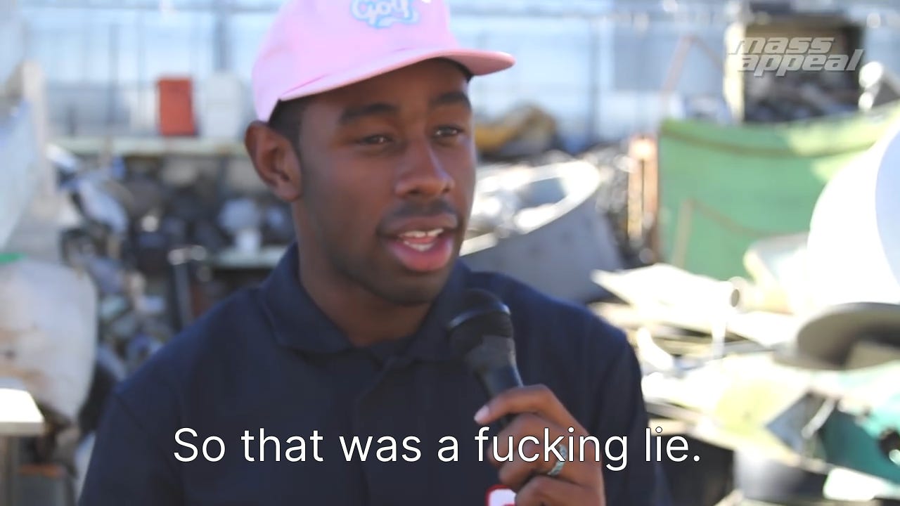So that was a fucking lie. | Tyler the Creator says the phrase on camera to a microphone while wearing a pink hat with what appears to be an out of focus dumpster in the background.