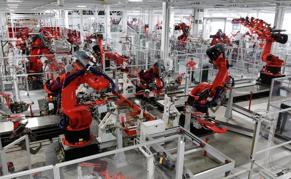 While the many robots in auto factories typically perform only one function, in the new Tesla factory in Fremont, Calif., a robot might do up to four: welding, riveting, bonding and installing a component.
