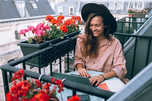 Woman working from home in Paris
