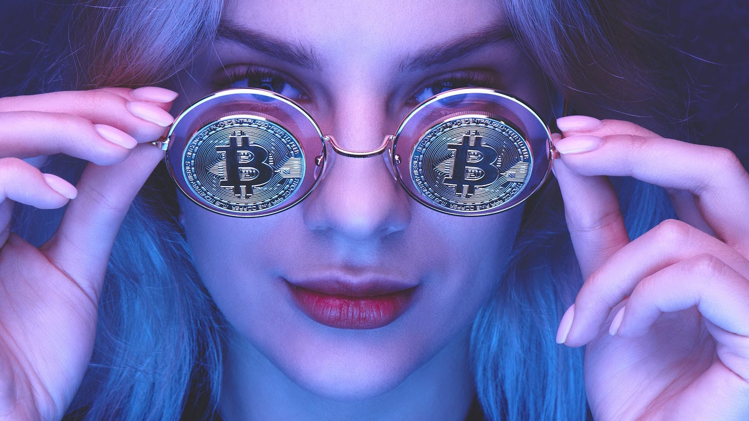woman removing glasses with physical Bitcoins on the lenses