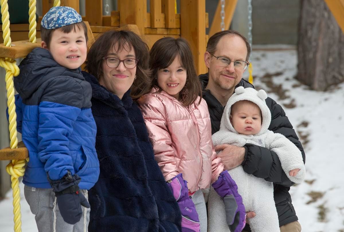 Hilary Edelstein, husband, Effi Frohwein, and their children Zachary, 5, (left), Mikayla, 7 and baby Koby, now 10 months old, are shown in the backyard of their Thornhill home. Zachary was the first to test positive for COVID-19 in December and then it spread to the rest of the family.