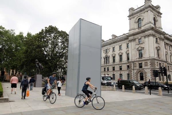 A statue of Winston Churchill was covered to protect it from vandalism in Parliament Square in central London on Friday.