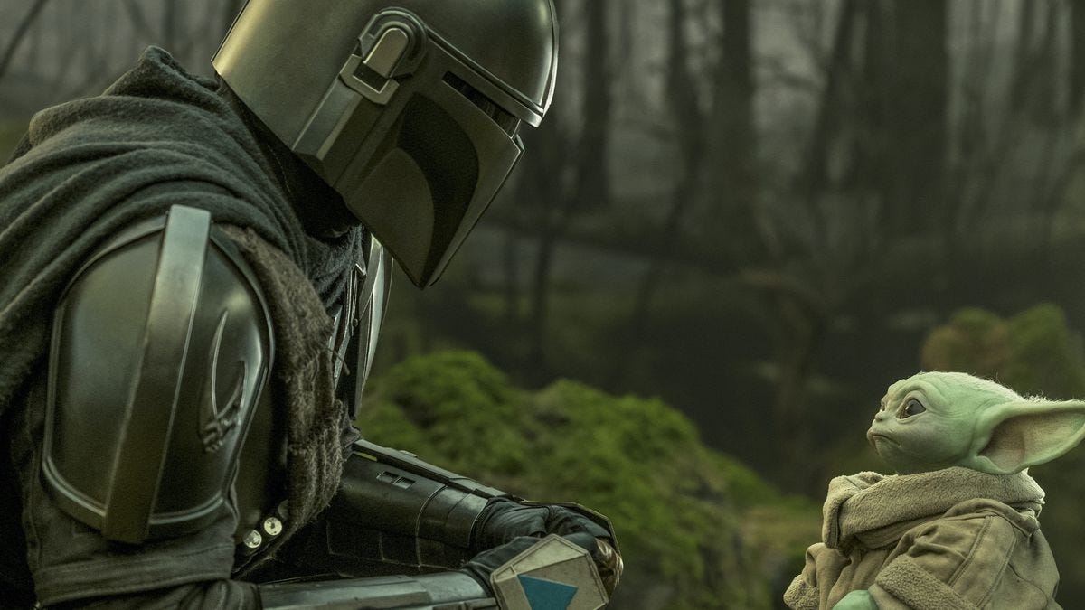 Djin and Grogu look at each other in a forest setting in episode 13 of The Mandalorian.