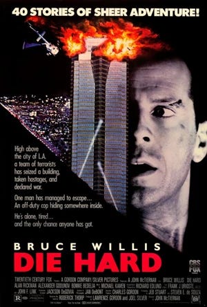 A movie poster with the title "Die Hard" and the cast list below it and Bruce Willis above it. Willis' face takes up the right side of the poster, but his face is halved by a  tower and a helicopter crashing into the top (coming from the left of frame) amidst explosions.