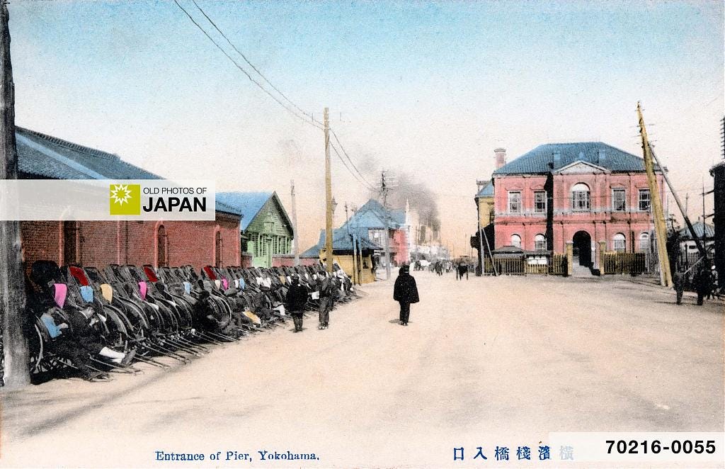 70216-0055 - A long row of rickshaws at the entrance to the pier in Yokohama Harbor, 1910s