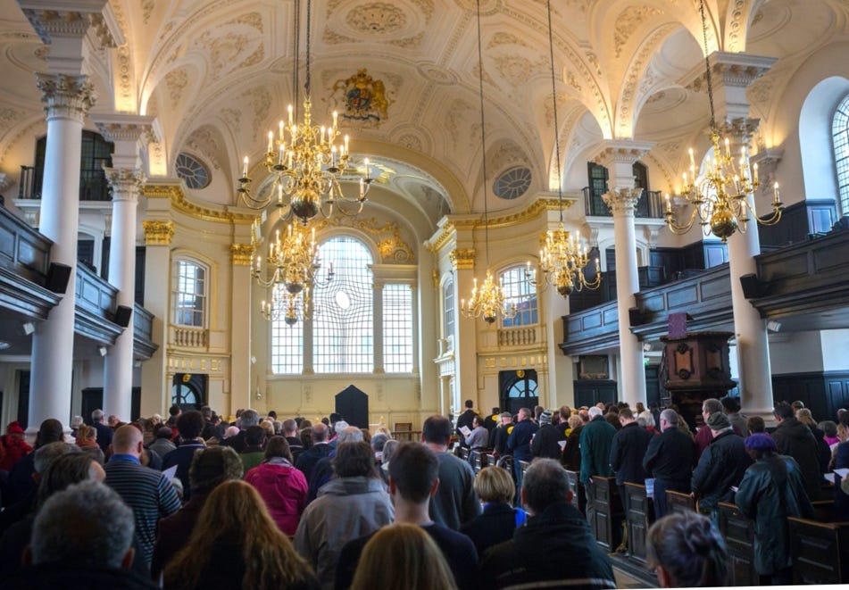 A large crowd of people in a church

Description automatically generated with medium confidence