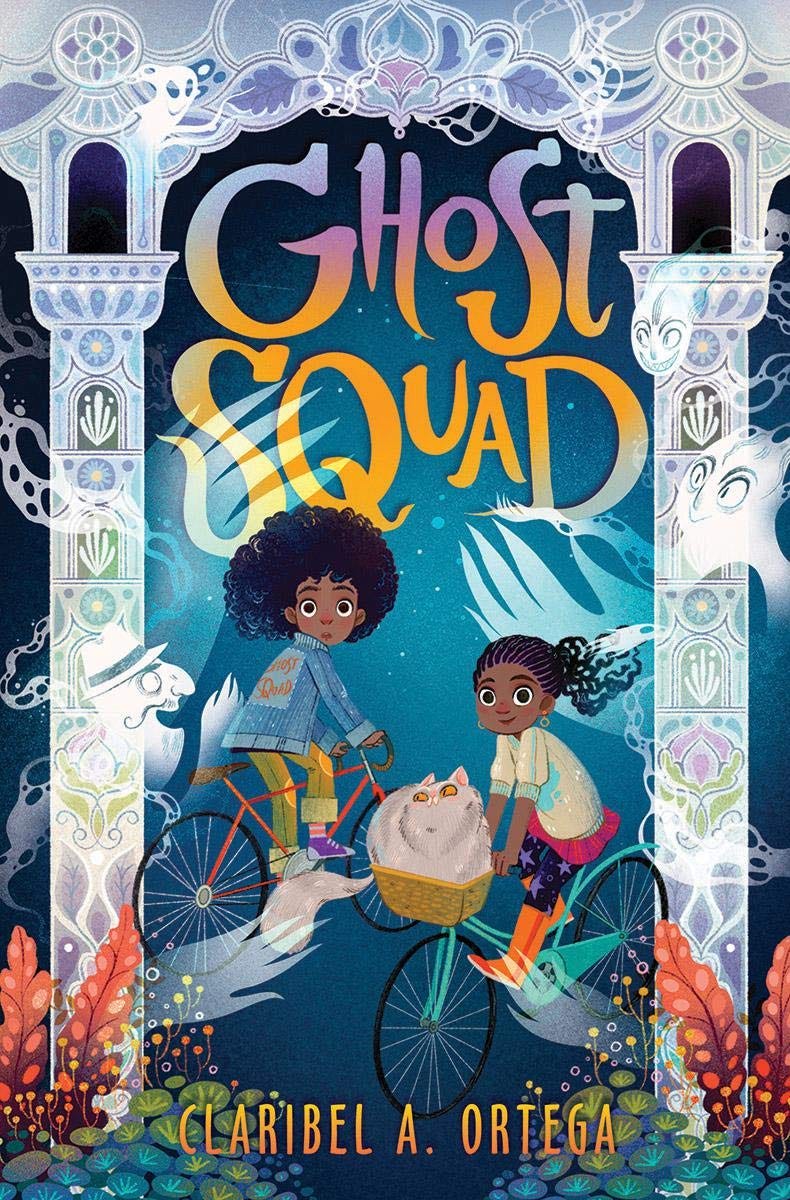 The cover features two Black girls riding bicycles. In the basket of one bicycle is a tabby cat and around them are many spirits. One girl wears a jean jacket and the other is wearing a pink skirt and leggings with stars on them. ‘Ghost Squad’ is written at the top in bright orange letters and the author’s name, Claribel Ortega, is printed at the bottom. 
