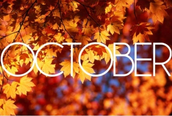 OCTOBER: White text against background of autumn foliage