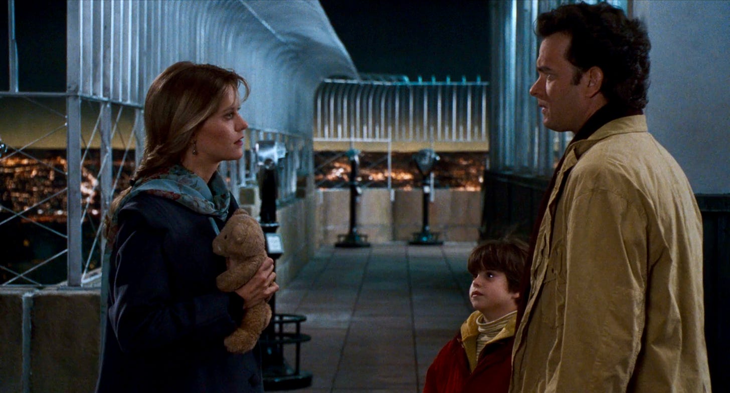 (l-r) Meg Ryan as Annie, Ross Malinger as Jonah, and Tom Hanks as Sam on top of the Empire State Building in SLEEPLESS IN SEATTLE.