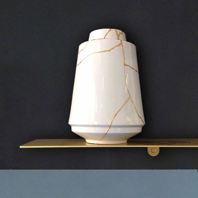 White vase with its cracks repaired by gold threads
