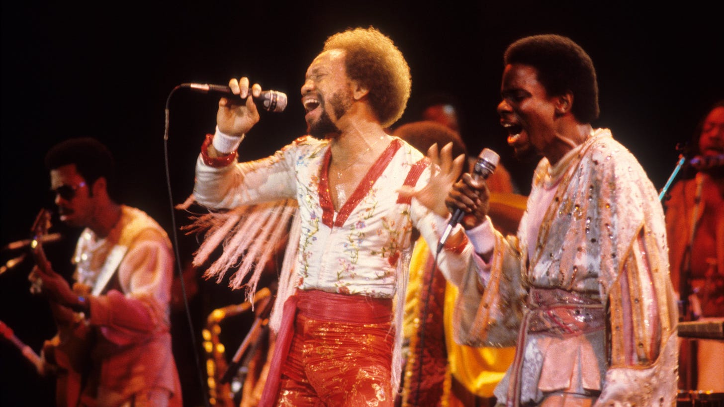 Earth, Wind & Fire performing on a stage.