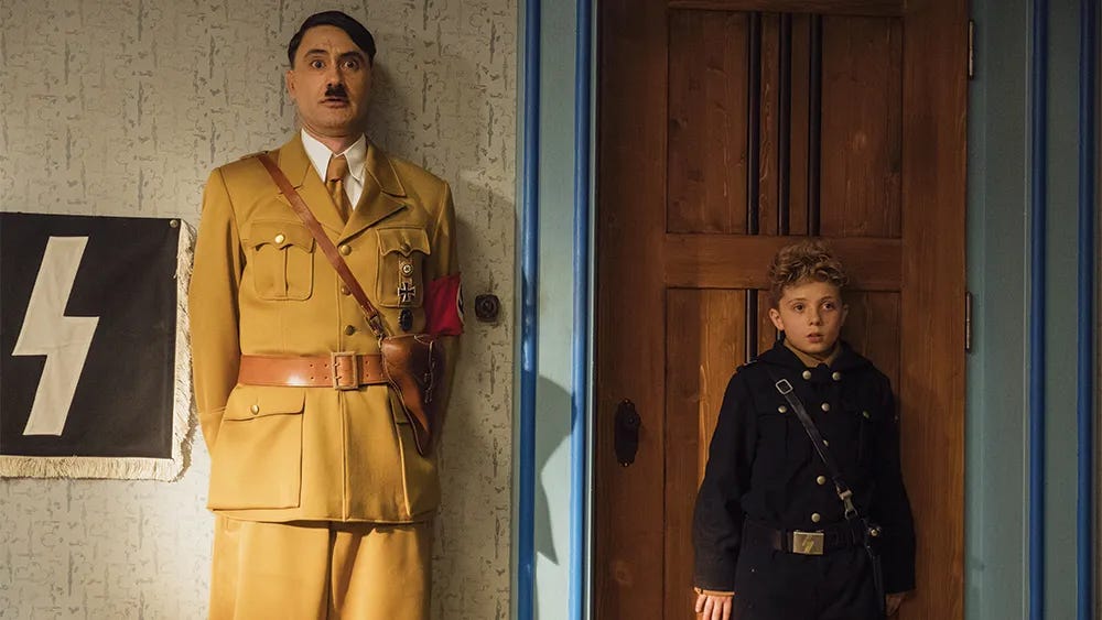 Jojo (Roman Griffith Davis) and Imaginary Adolf Hitler (Taika Waititi) after a Gestapo inspection.