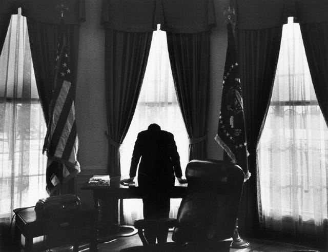 This famous image of President John F. Kennedy leaning on a desk in the Oval Office has become a well-known icon and metaphor for the loneliness that the American presidency can create for its holder. This famous image of President John F. Kennedy leaning on a desk in the Oval Office has become a well-known icon and metaphor for the loneliness that the American presidency can create for its holder.