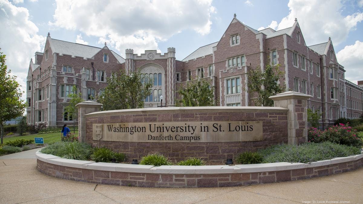 This image shows the main entrance to Washington University in St. Louis's Danforth (or main) Campus, with the university's name and logo etched in stone.