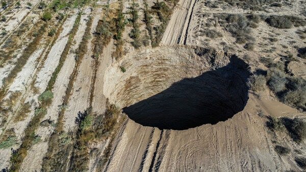 An aerial view shows the large sinkhole that appeared over the weekend near the mining town of Tierra Amarilla, Copiapo Province in Chile.