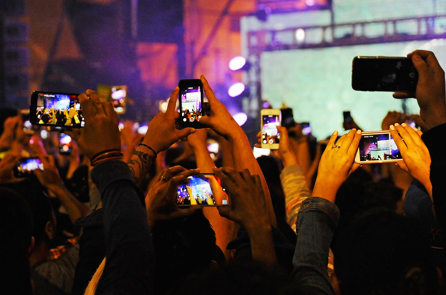 Image result for phones at a concert
