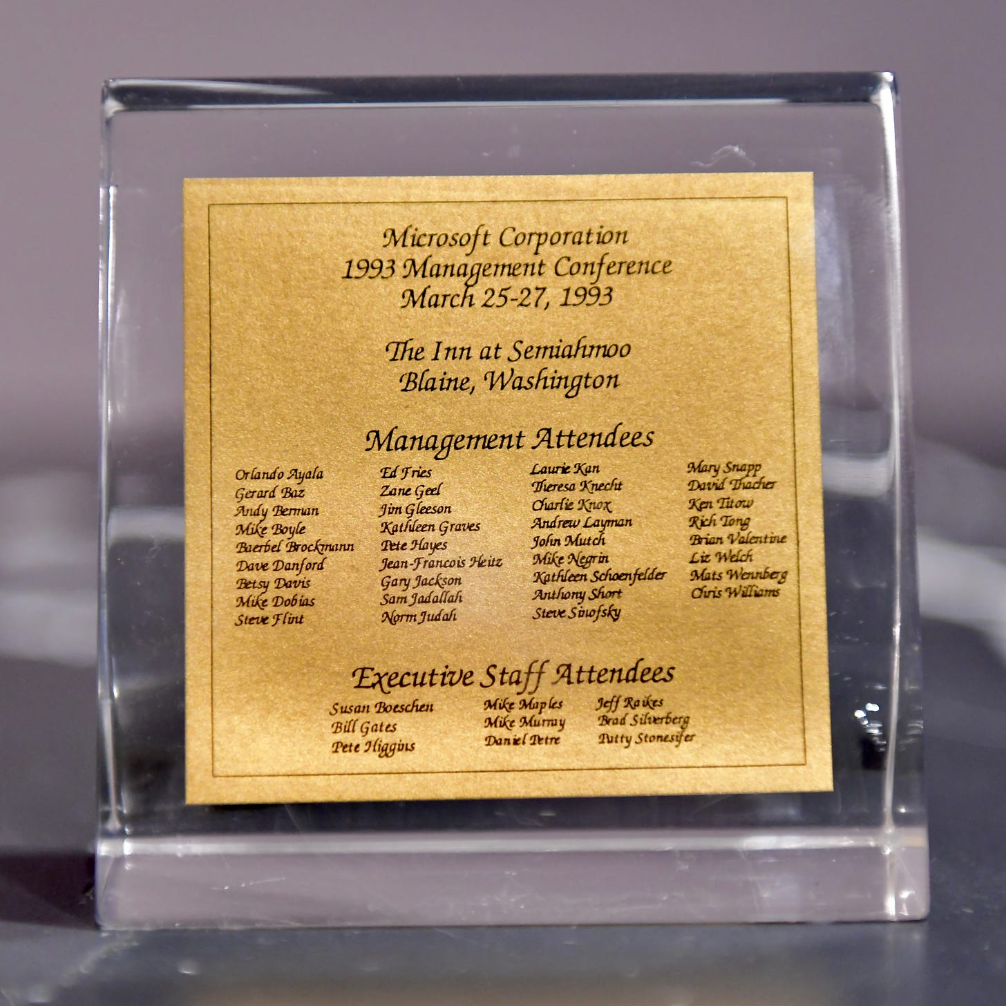 Lucite block to place on desk. Title is "Microsoft Corporation 1993 Management conference" with list of attendees and executive staff.