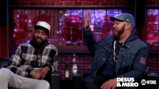 Comedians Desus and Mero high-five each other