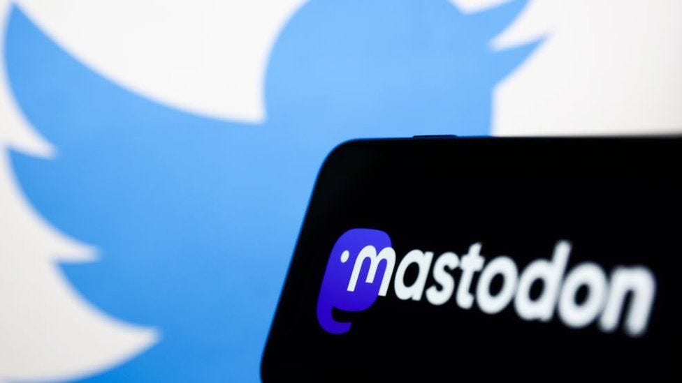the logo for mastodon is superimposed over a blurry, distant twitter bird logo.