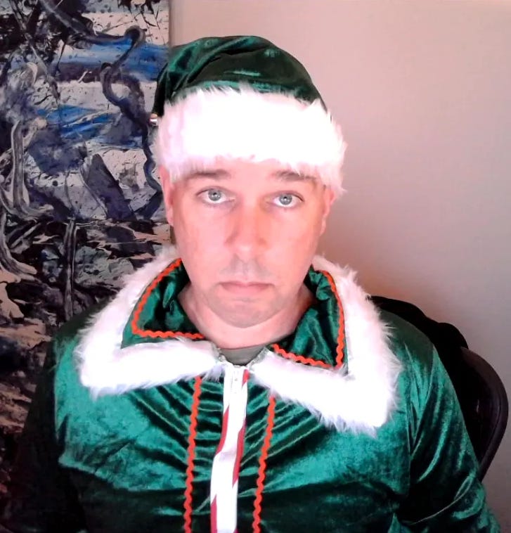Choire Sicha wearing an elf uniform on a video call
