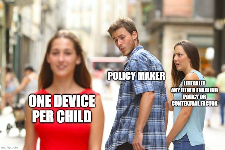 Distracted boyfriend meme, with the girl in red as 'one device per child', the boyfriend as 'policy maker' and the girlfriend as 'literally any other enabling policy of contextual factor'