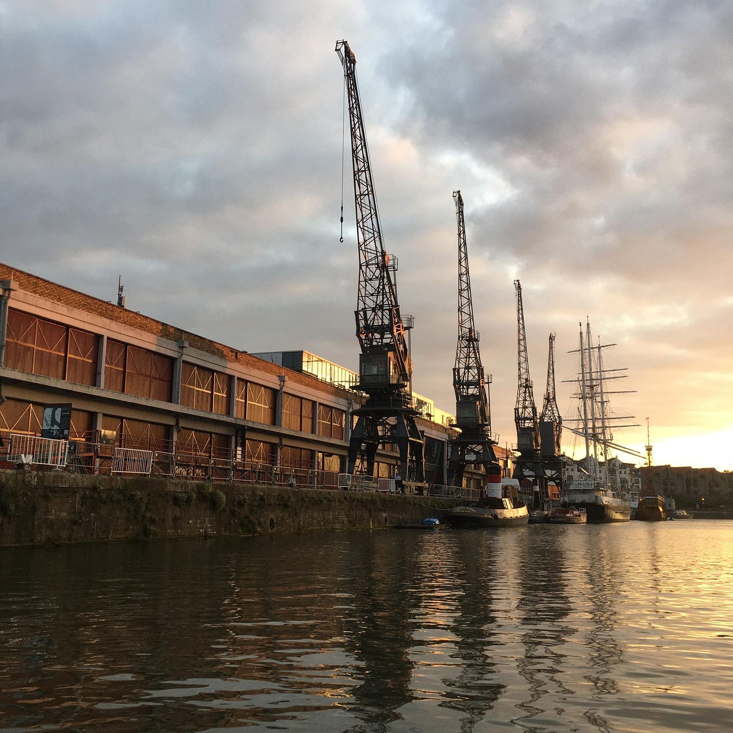 Cranes bt MShed in Bristol beside the water
