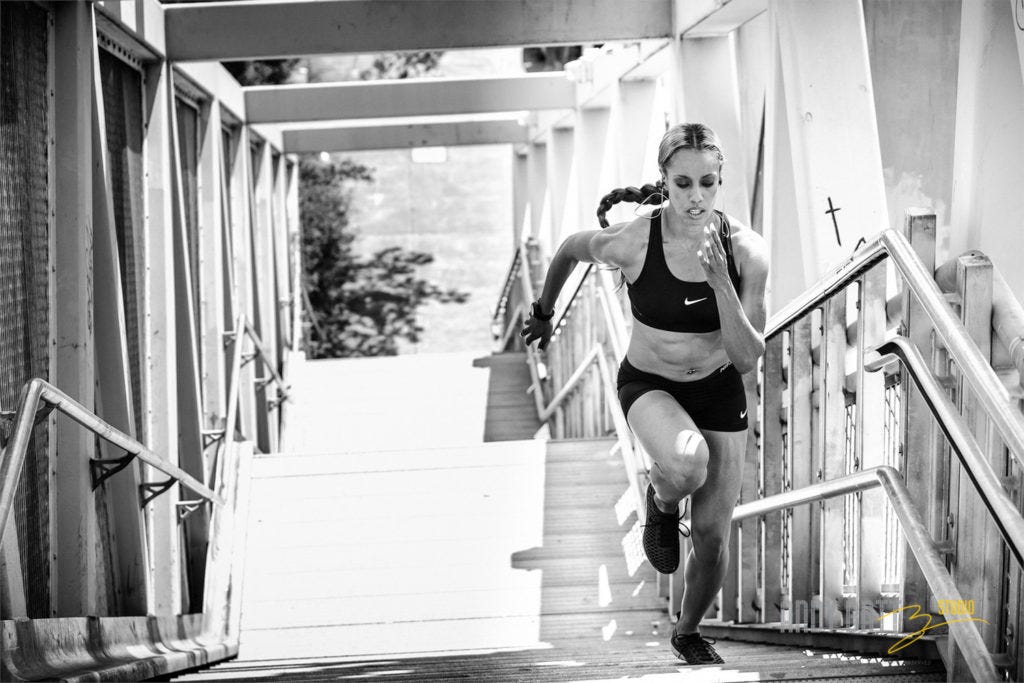 Olympian track and field runner Carol Rodriguez. Dramatic (not boring) stock photo of an Olympian training on stairs