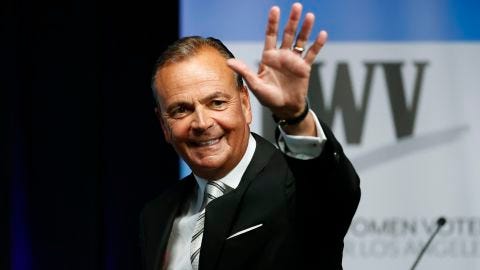 Los Angeles mayoral hopeful Rick Caruso waves at the start of a  debate on the California State University, Los Angeles, campus on May 1, 2022. 