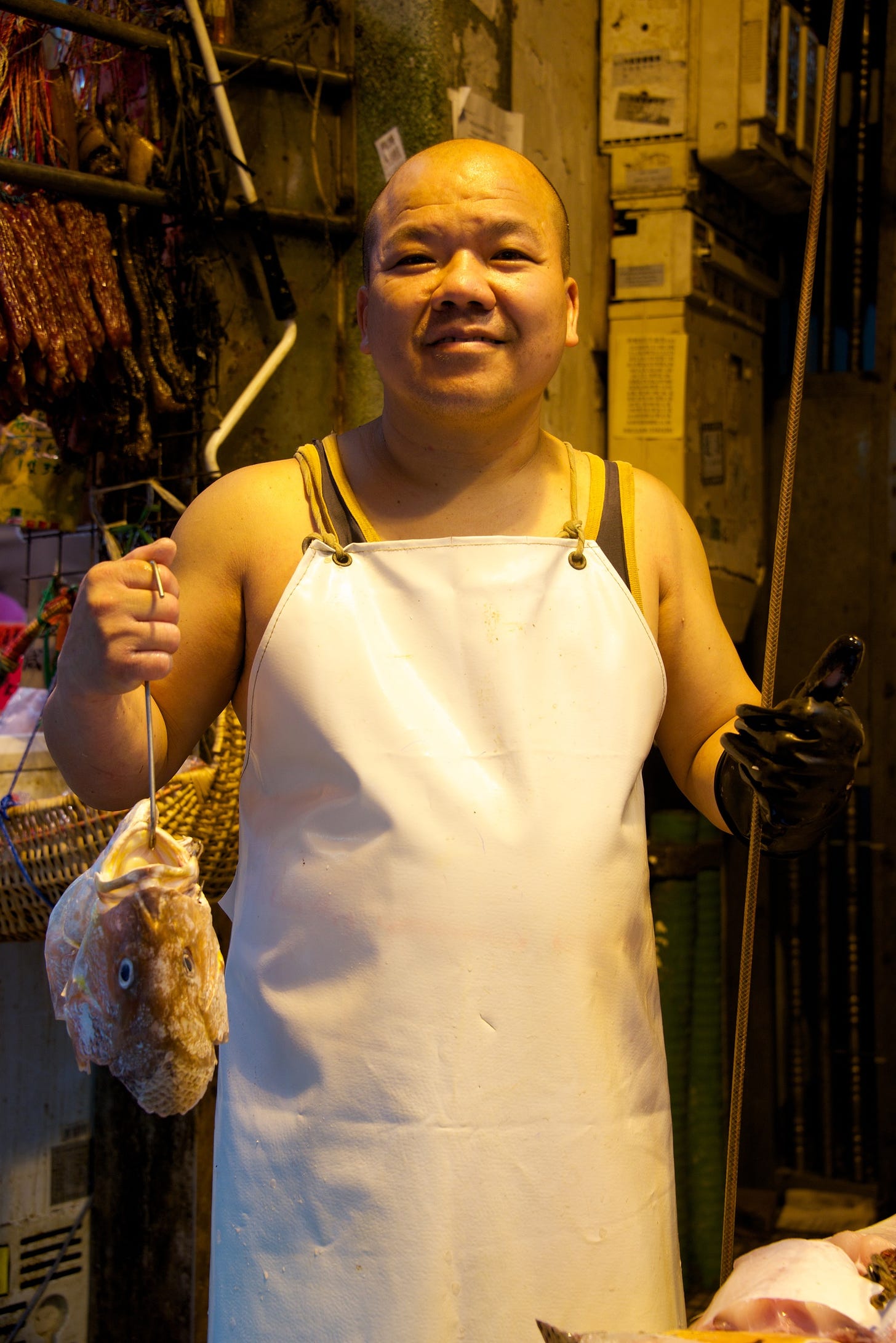 Smiling Chinese fishmonger