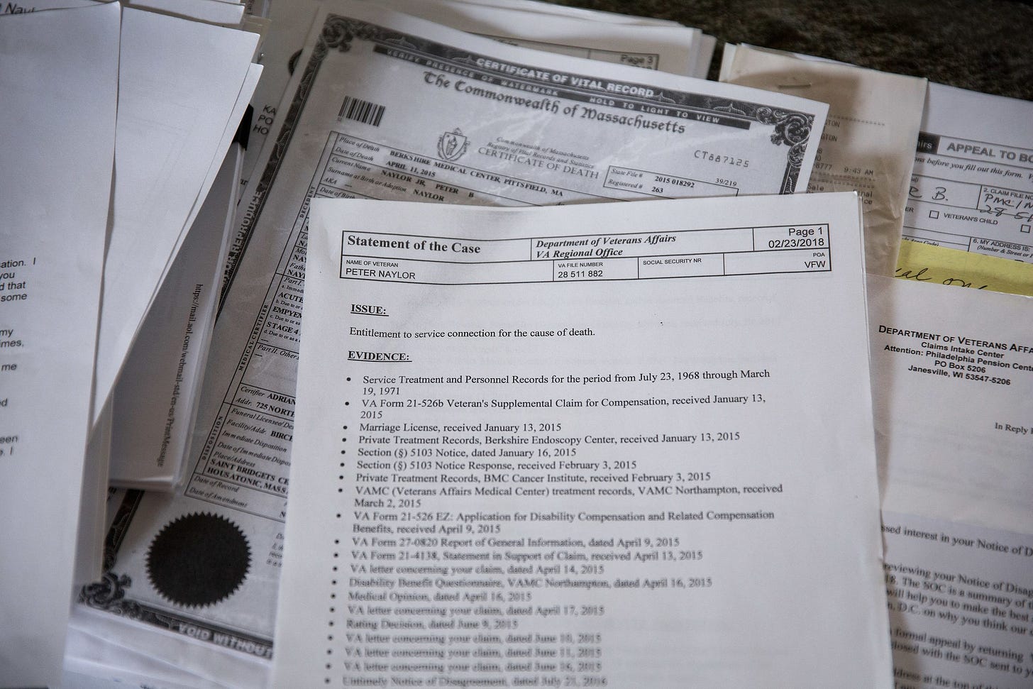 Stacks of paperwork that Kate Naylor has collected in pursuit of receiving compensation from the Department of Veteran Affair