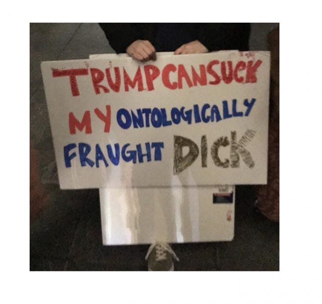 protest sign that says "trump can suck my ontologically fraught dick"