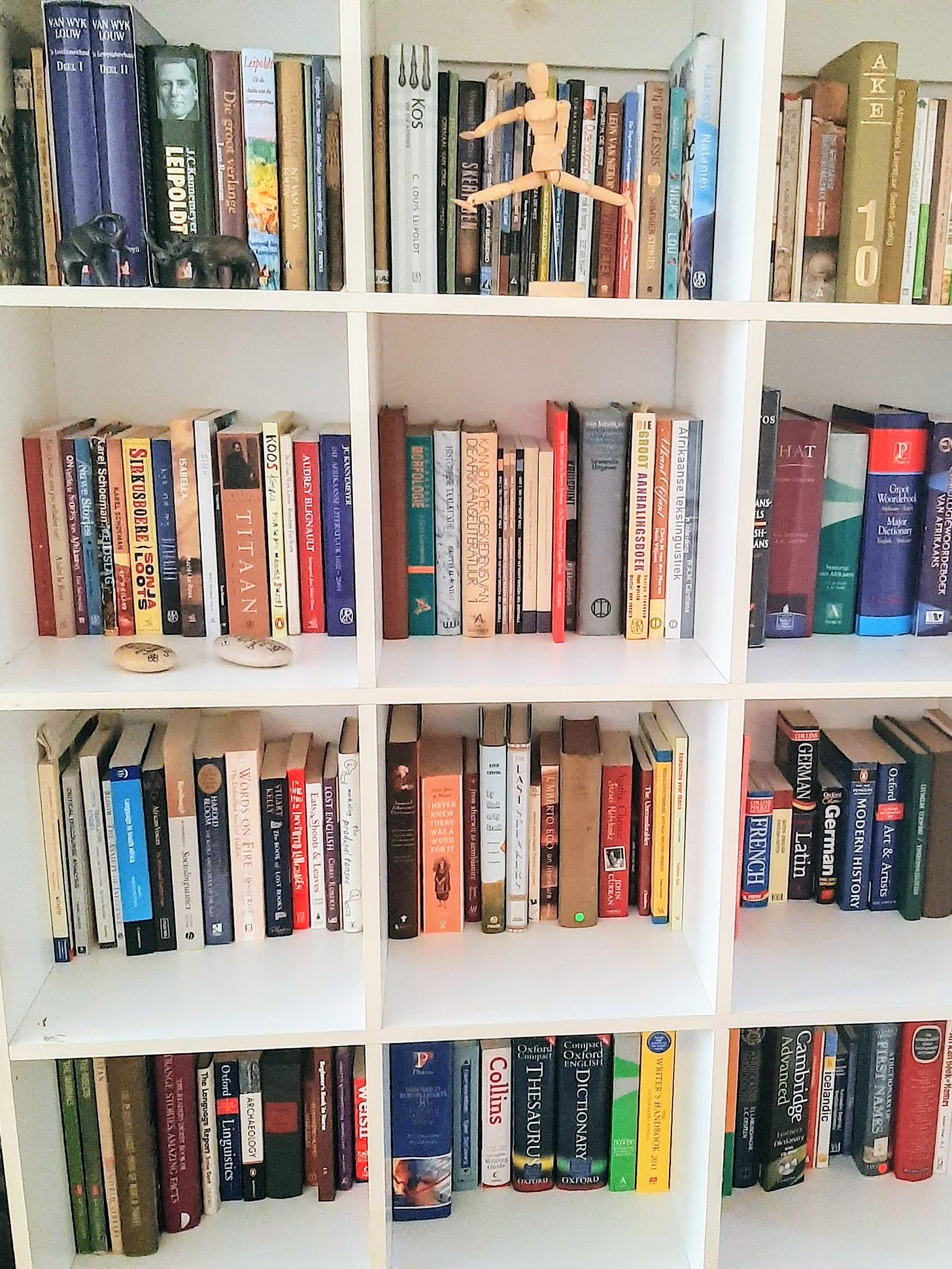 white bookshelf filled with books