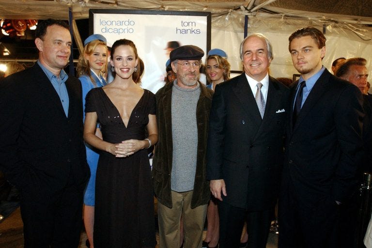 Frank W. Abagnale Jr. (second from the right) is famous for his audacious cons, documented in the blockbuster movie “Catch Me If You Can.” But science writer Alan Logan says the real grift is Abagnale’s entire life story. (Rene Macura/AP Photo)