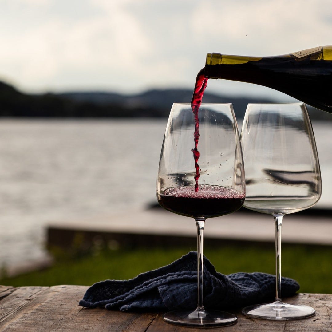 A picture containing sky, wine, water, outdoor

Description automatically generated