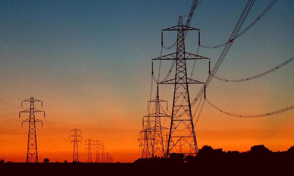A picture containing sunset, outdoor, pylon, setting

Description automatically generated