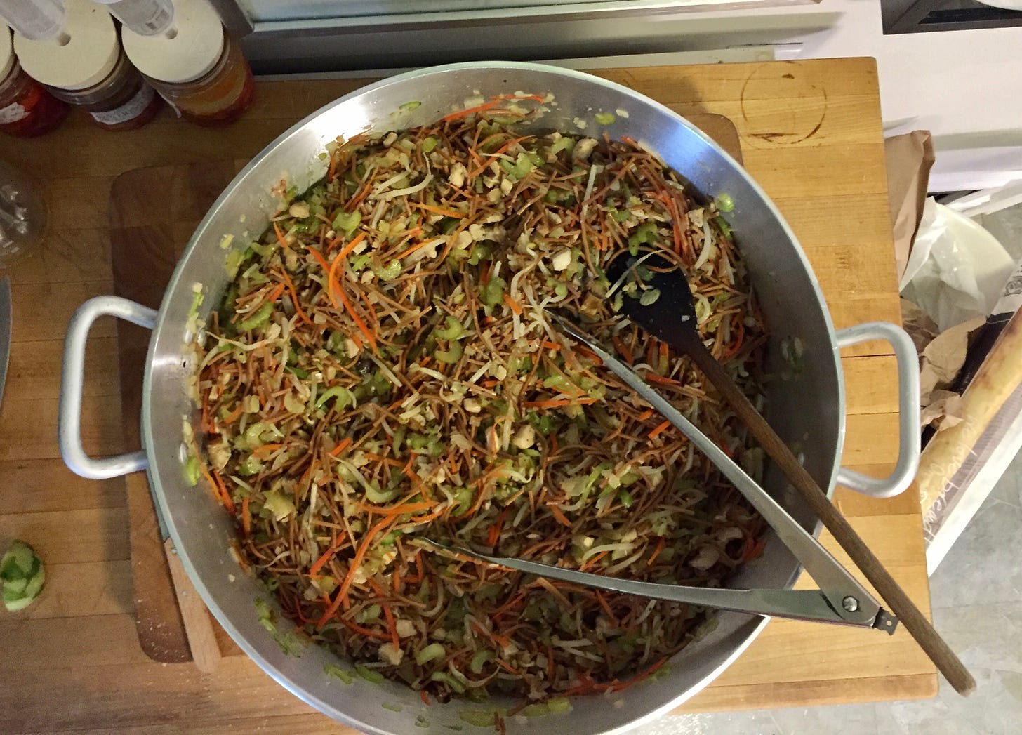 A large cooking pot filled with a fresh batch of chow mein