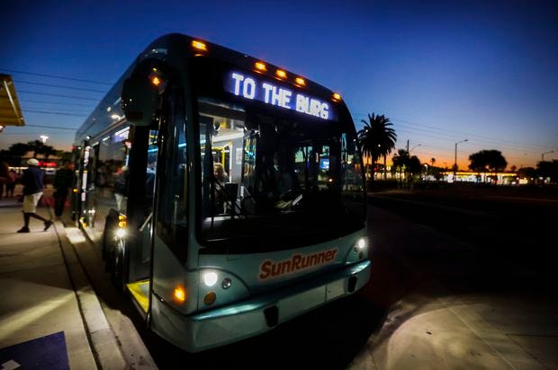 The maiden voyage of the SunRunner pulls up to the St. Pete Beach stop as the sun rises on Friday, Oct. 21, 2022 in St. Petersburg. The SunRunner, the new bus line run by the Pinellas Suncoast Transit Authority (PSTA), started service at 6am Friday morning. 

