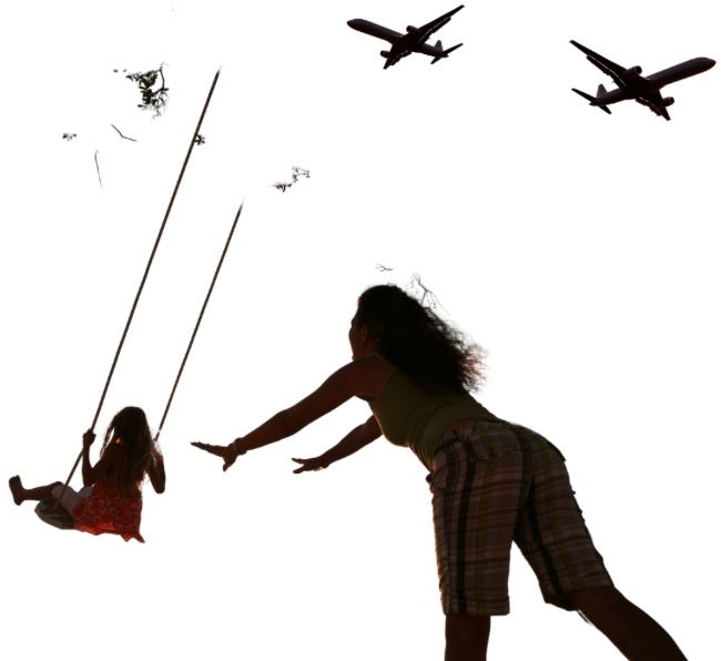 Silhouette of woman pushing girl on swing with two airliners heading in opposite directions in the sky