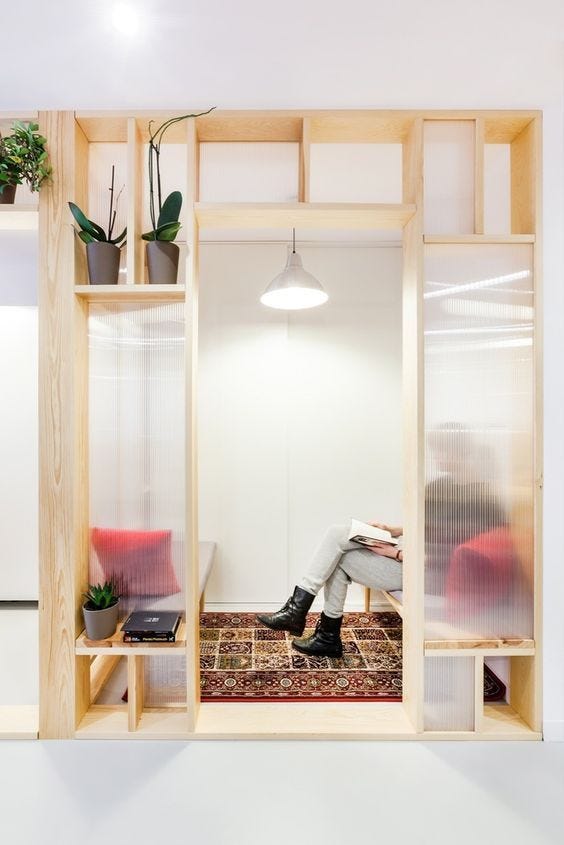 free standing plywood nook with person inside